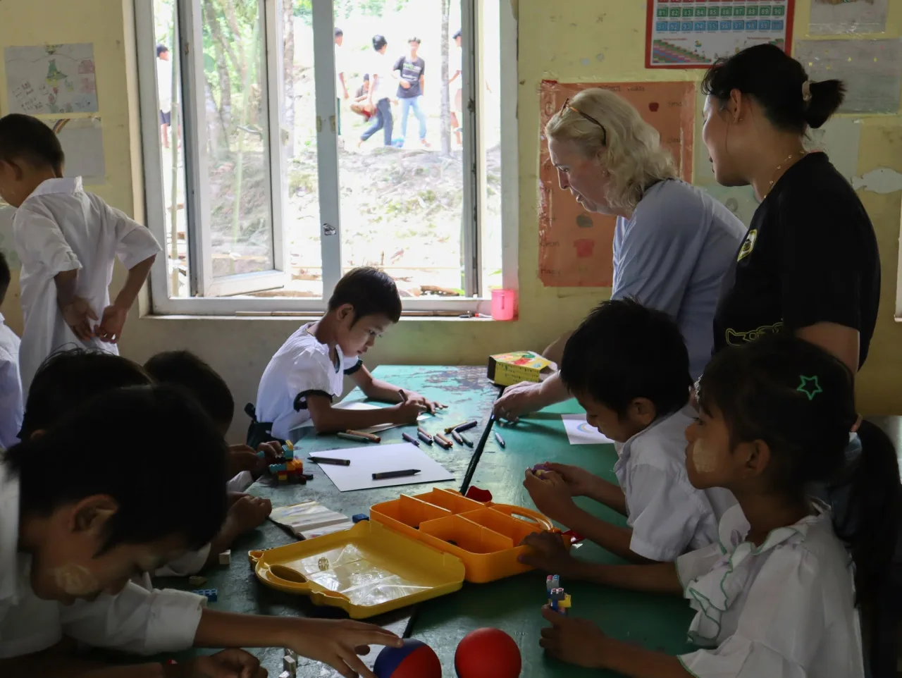 A child having a health check-up by a nurse during a community medical outreach