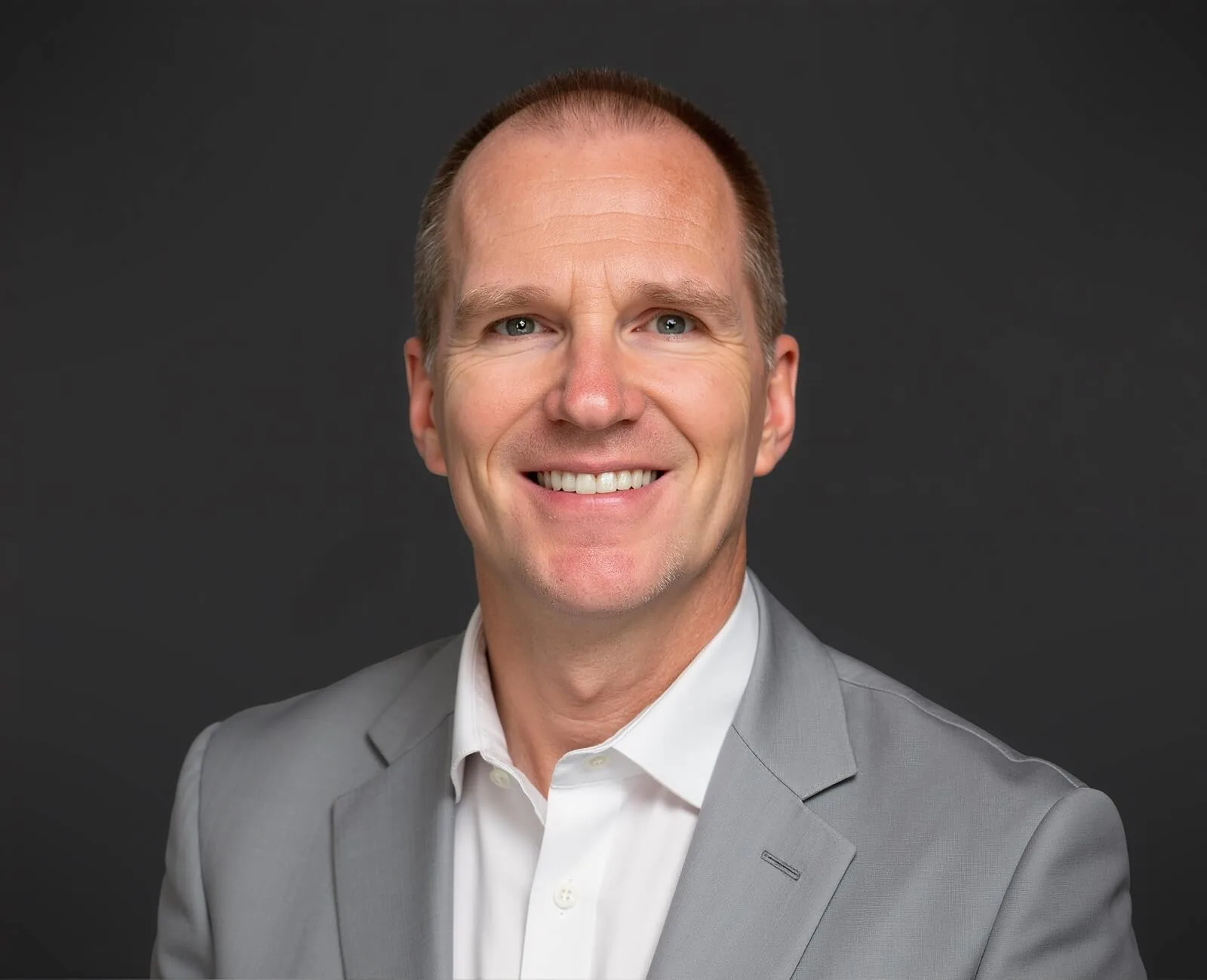 Portrait of Cameron Janzen, VisionNext partner consultant in strategic operations and finance